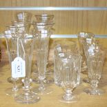 A group of nine glass champagne flutes, late 19th Century, each with facet cut bowl on a knop stem