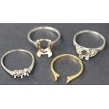 An 18ct gold ring mount and three other ring mounts.