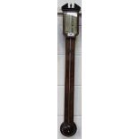 A George III mahogany stick barometer, the silvered dial with mercury thermometer, vernier scale and