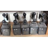 A set of five black painted cast metal exterior wall mounted lanterns on bracket supports, height