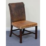 A 20th Century brown leather and studwork side chair with upholstered seat and back, raised on block