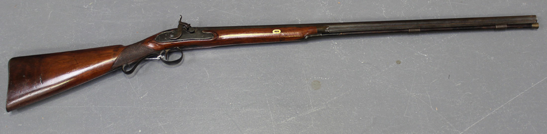 A 20 bore percussion sporting gun, barrel length approx 80cm, gold lined at breech, converted to