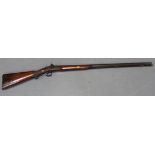 A 20 bore percussion sporting gun, barrel length approx 80cm, gold lined at breech, converted to