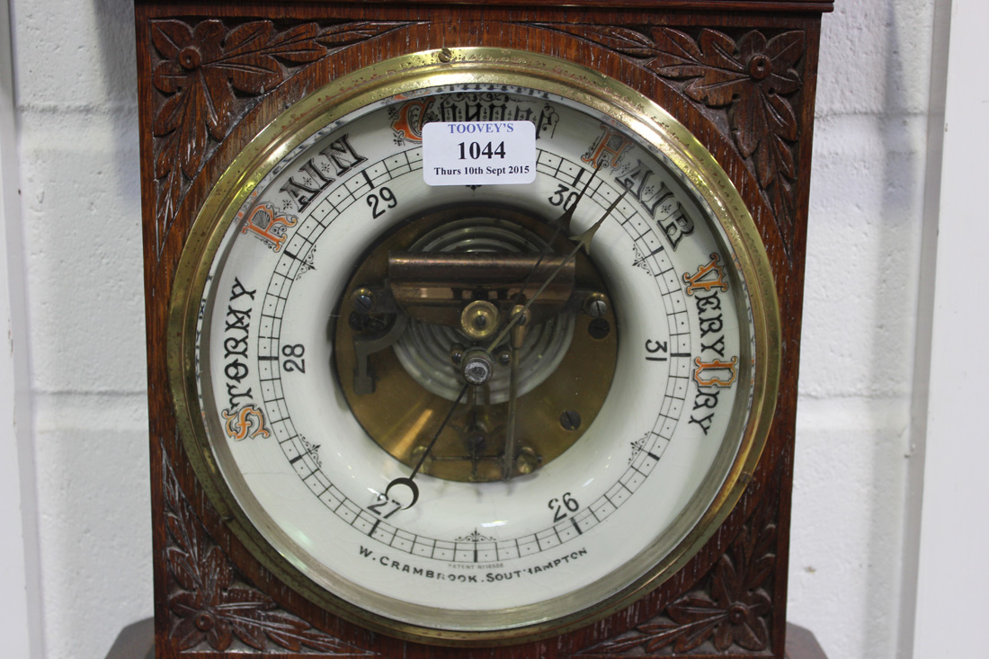 A late Victorian oak aneroid barometer with mercury thermometer, the ceramic circular dial inscribed - Image 2 of 2