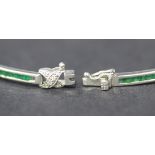 An 18ct white gold, emerald and diamond set bracelet, each rectangular link set with eight