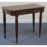 A William IV rosewood fold-over card table with beaded decoration, raised on turned and reeded