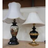 An early 20th Century gilded and black painted cast metal table lamp of classical form, together