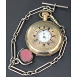 A gilt metal half hunting cased gentleman's pocket watch, the enamel dial with black Roman numerals,