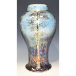 A Crown Devon Lustrine 'Birch' pattern vase and cover, the baluster body painted and gilt with