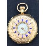 A gold keyless wind half hunting cased lady's fob watch with an unsigned gilt cylinder movement, the