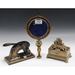 A late 19th Century brass and champlevé enamel swing frame mirror, the circular frame with