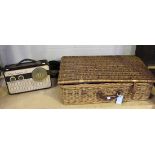A mid-20th Century wicker 'Coracle' picnic hamper with tin containers and plastic cups, together