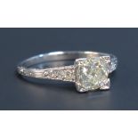 A white gold and diamond set gold ring, mounted with the principle old cut cushion cut shaped