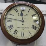A late 19th Century mahogany circular wall clock with brass single fusee movement, the painted