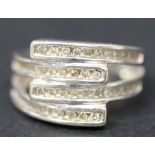 A 9ct white gold and diamond set ring, mounted with four rows of circular cut diamonds in an