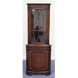 A late 20th Century reproduction mahogany corner display cabinet fitted with an astragal glazed door