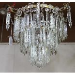 A pair of cut clear glass three-tier graduated chandeliers, hung with spear drops, diameter approx