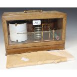 A George V mahogany cased barograph with lacquered brass mechanism and recording drum, detailed '