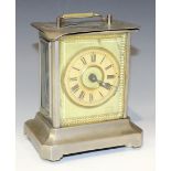 An early 20th Century German plated carriage alarm clock by Junghans, the glazed case with