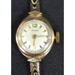 A Garrard 9ct gold lady's bracelet wristwatch, the signed circular silvered dial with gilt numeral