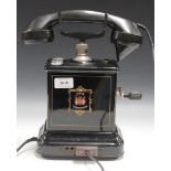 An early 20th Century Danish 'Jydsk' black enamelled cradle telephone with winding handle and