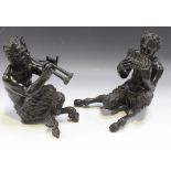 A pair of late 19th Century black patinated cast bronze figures of seated fauns, one playing pan