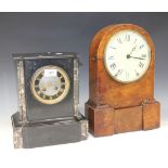 A late 19th Century slate mantel clock with eight day movement striking on a bell, the dial with