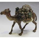 An Austrian cold painted cast bronze figure of a heavily laden camel, marked 'Geschützt 3063' to