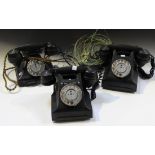 An early 20th Century black cased pyramid telephone and two other black cased telephones.