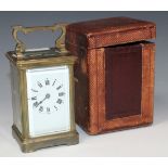 A late 19th/early 20th Century lacquered brass carriage clock with eight day movement striking on