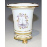 A porcelain spill vase, early 19th Century, of flared form, the body painted with a soldier on