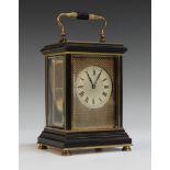 A late 19th Century French brass and ebonized carriage clock with eight day movement striking on a