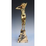 Carl Kauba - an Art Deco Austrian gilt cast bronze full-length figure of a nude young woman, holding
