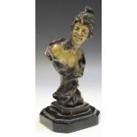 An Art Nouveau style cast bronze head and shoulders portrait of a lady, bearing indistinct mark to