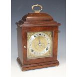 A mid-20th Century mahogany mantel clock with eight day movement striking on a bell, the brass