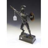 An early 20th Century patinated cast spelter figure of a standing Roman warrior with plumed