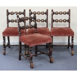 A set of four George V oak bar back dining chairs, the upholstered seats on shaped supports.