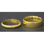 A 22ct gold wedding ring, Birmingham 1900, ring size approx L1/2, and a 22ct gold wedding ring,