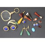 A pair of 9ct gold and lapis lazuli ear clips, a two colour gold and emerald brooch, designed as a