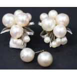 A pair of sterling silver mounted cultured pearl earclips, each designed as a spray, each length