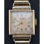 An Ancre gold rectangular cased lady's wristwatch, the signed square gilt dial with gilt Arabic