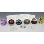 A collection of six Caithness paperweights, comprising 'Earth', 'Air', 'Fire' and 'Water', 'Silver