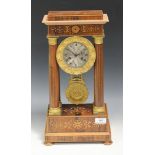 A 19th Century French rosewood and marquetry inlaid portico mantel clock with eight day movement