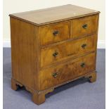 A 20th Century George III style walnut and crossbanded chest of two short and two long drawers, on