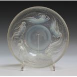 A Lalique clear and opalescent glass Ondines pattern circular bowl, number 380, the underside