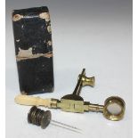 An early 19th Century lacquered brass folding pocket microscope with turned ivory handle and