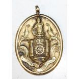 A 19th Century livery company badge of oval form, depicting a central wheel with a crown above, an