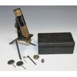 A black enamelled and lacquered brass monocular student's microscope, signed 'Beck, No. 40132', with