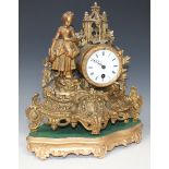 A late 19th Century French gilt spelter mantel timepiece, the enamel dial with black Roman numerals,