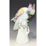 A Continental porcelain model of a parrot, late 19th Century, modelled perched on a stump with